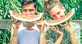 Couple eating watermelon